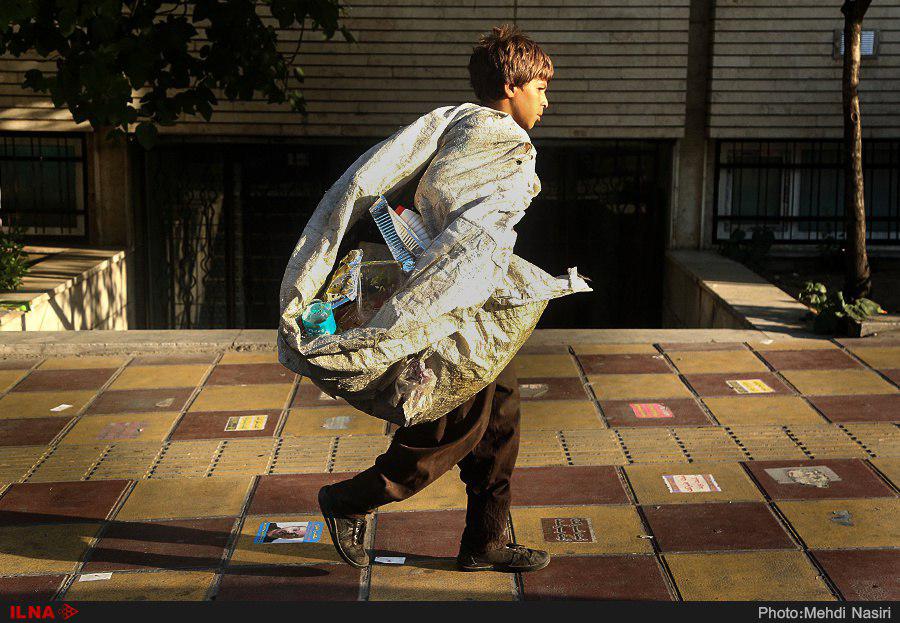 A teenager collecting trash in Iran